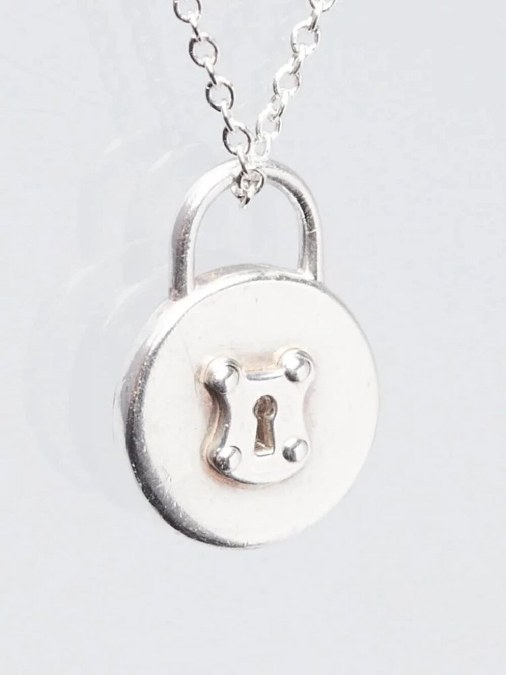 Tiffany & Co. Sterling Silver Round Lock Pendant Necklace